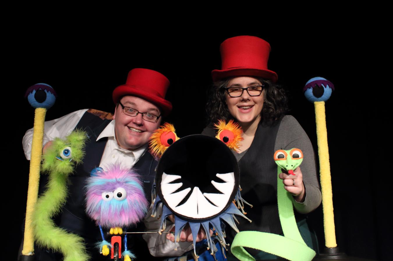 Photo of CactusHead Puppets puppeteers smiling and holding four puppets.