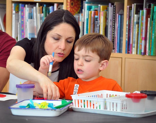 Mother and son making art at The Eric Carle Museum