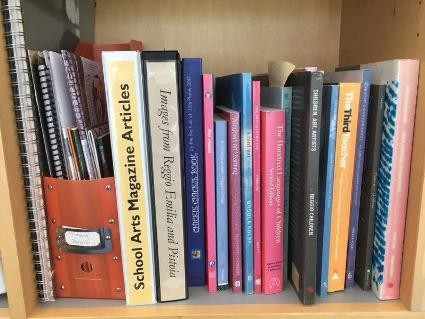 A shelf filled with education books and resources.