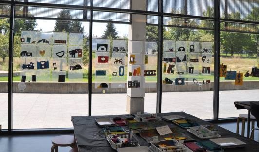 stencils on display in three of the art studio windows