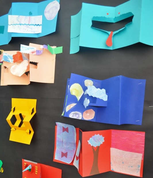 The display wall of accordion books with different pop-ups and lift flaps.